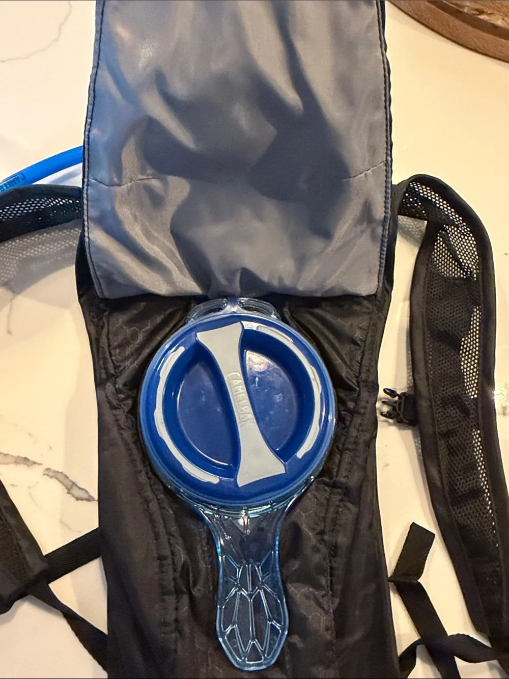 Camelbak Black Hydration Pack with Blue Drinking Tube